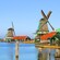 A village of windmills situated along the water in Zaanse Schans, Netherlands